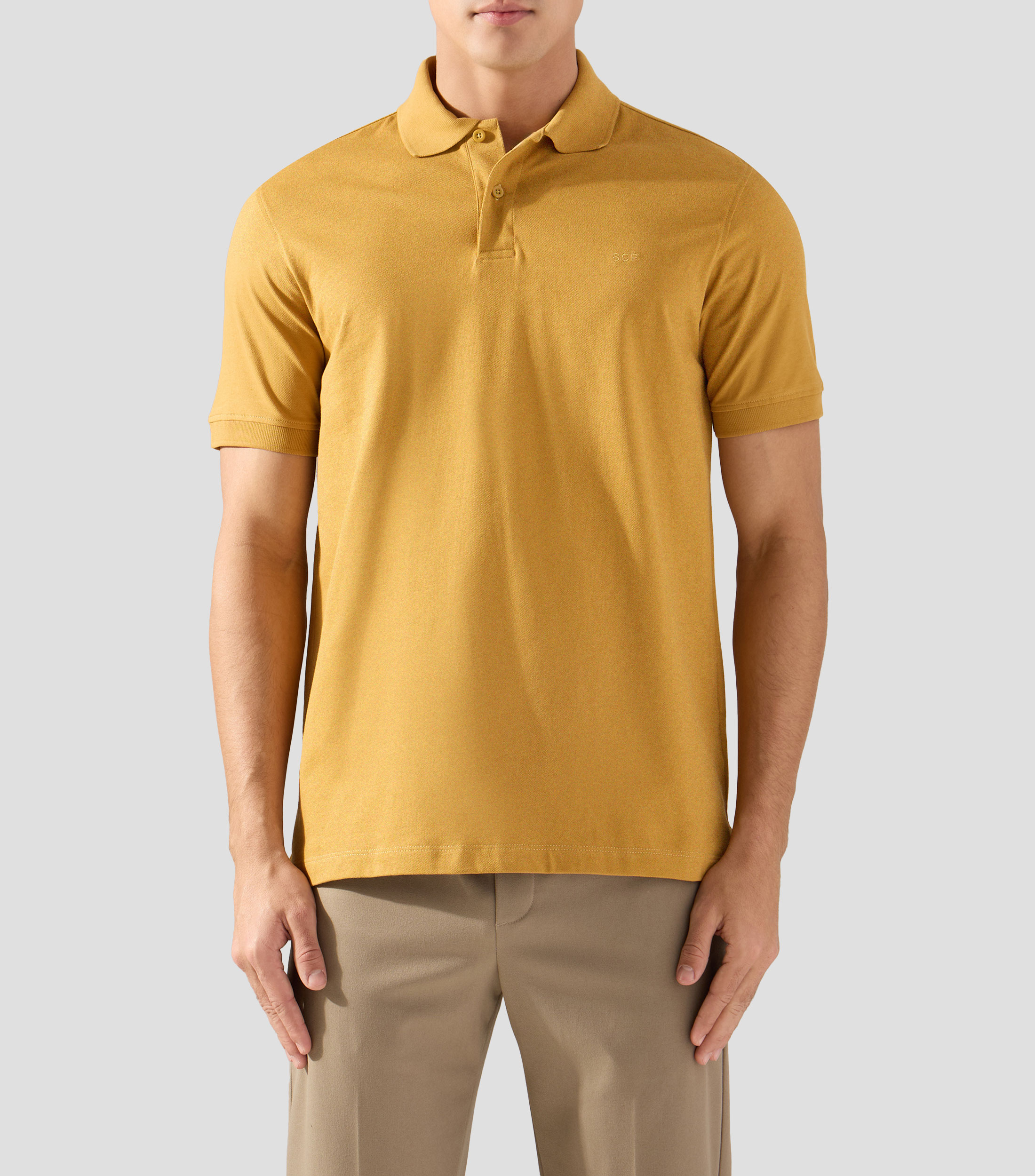 Playera tipo polo con manga corta lisa Hombre